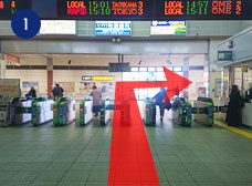 From the Exit, turn right and go down the escalator.